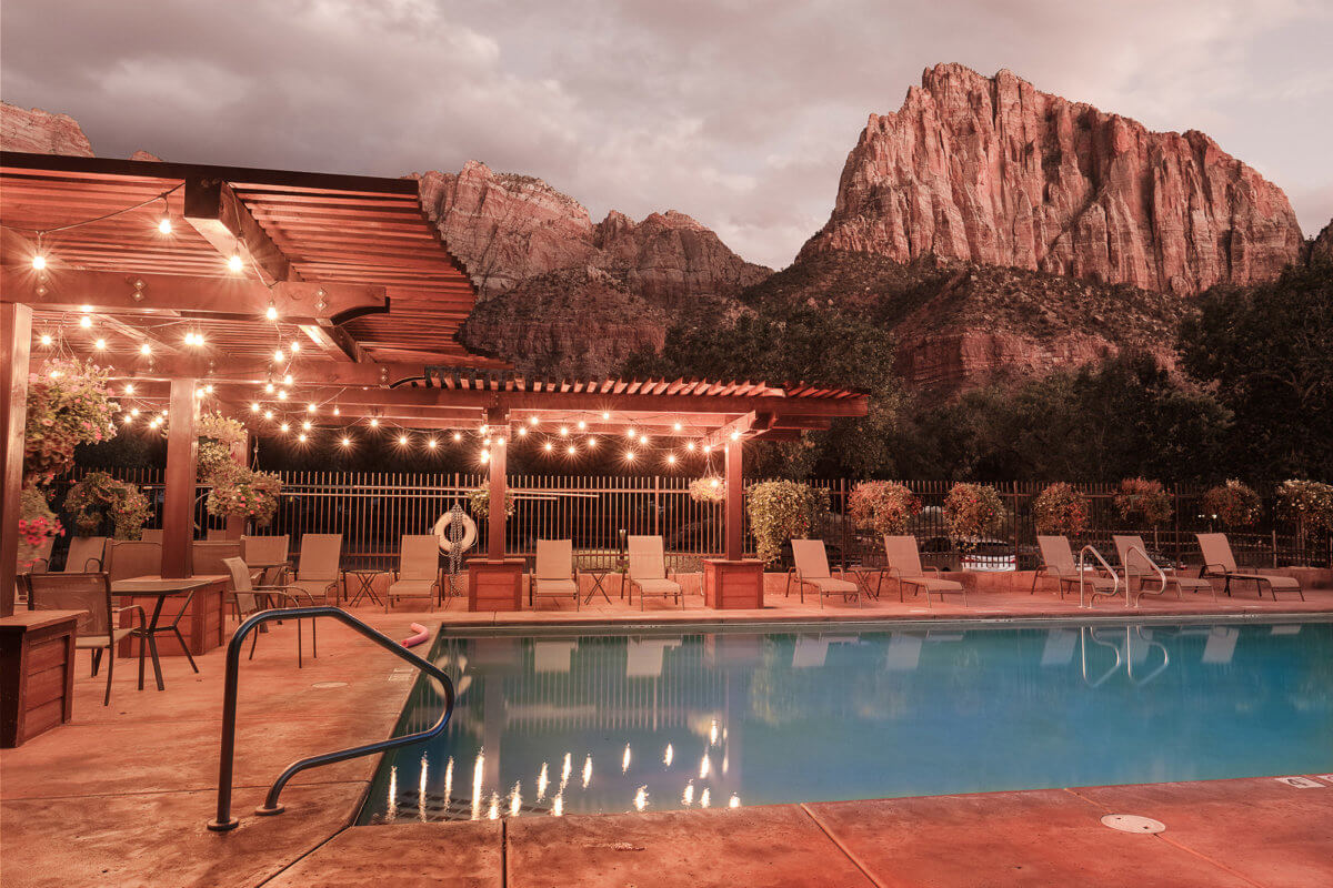 Outdoor pool at mountain hotel at dusk
