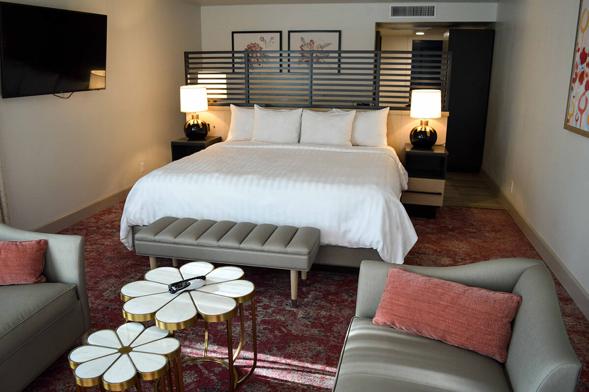 Hotel suite with king size bed and seating area