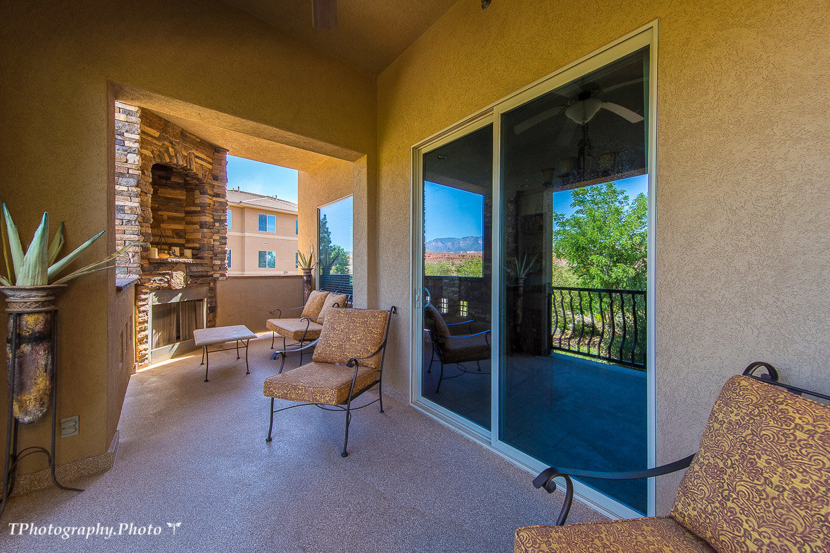 Oversized balcony with padded lounge chairs
