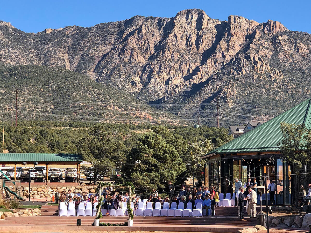 Mountains looming over outdoor event setting