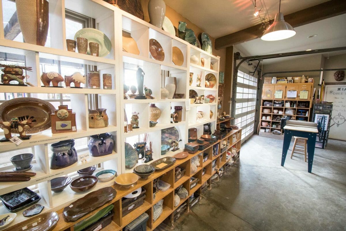 Shelves filled with clay pottery.