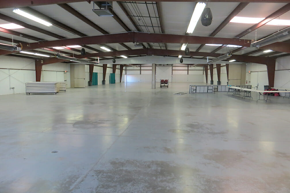 Large empty building with concrete floors
