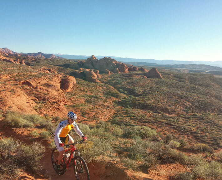 Mountain biker on desert trail.