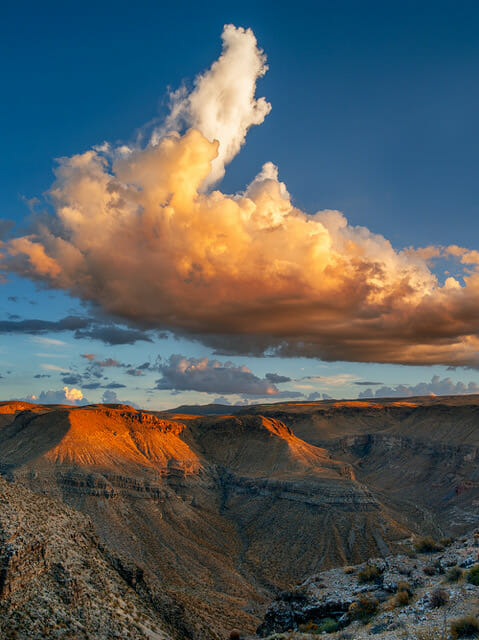 Painted sky over red rock bluffs. Photo Credit: Nathan Wotkyns