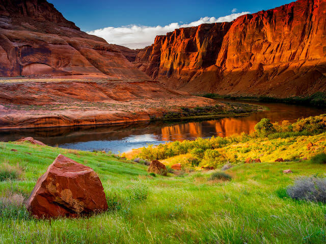 Reflection of Red Mountains in water. Photo Credit: Nathan Wotkyns