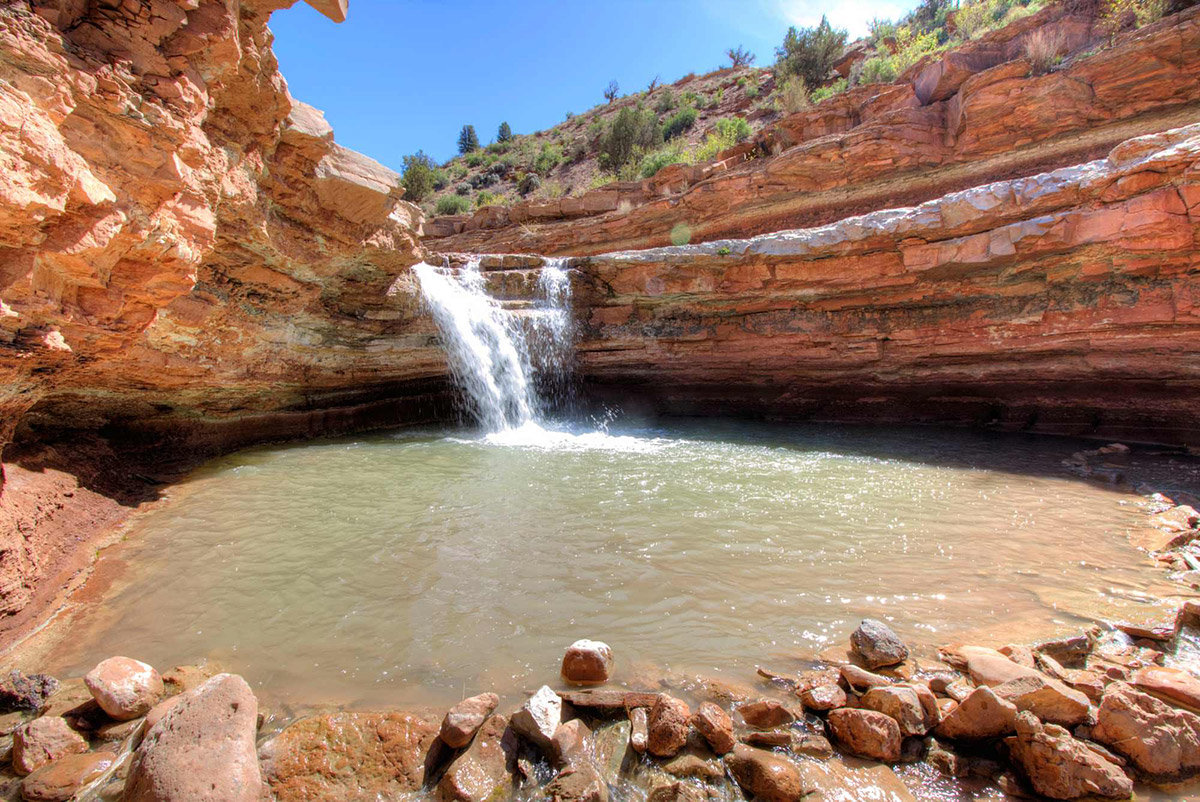 Pool at the bottom of desert waterfall
