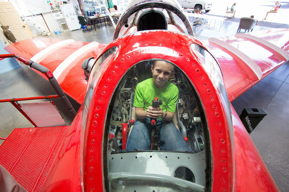 Young boy in cockpit of plane