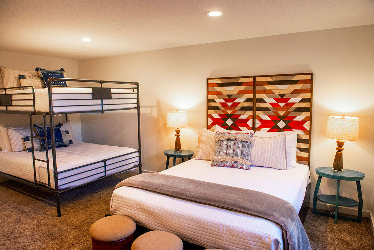 Bedroom with queen bed and bunk beds